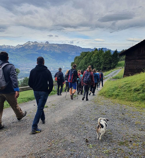 A group hikes on the WalserSagenWeg.